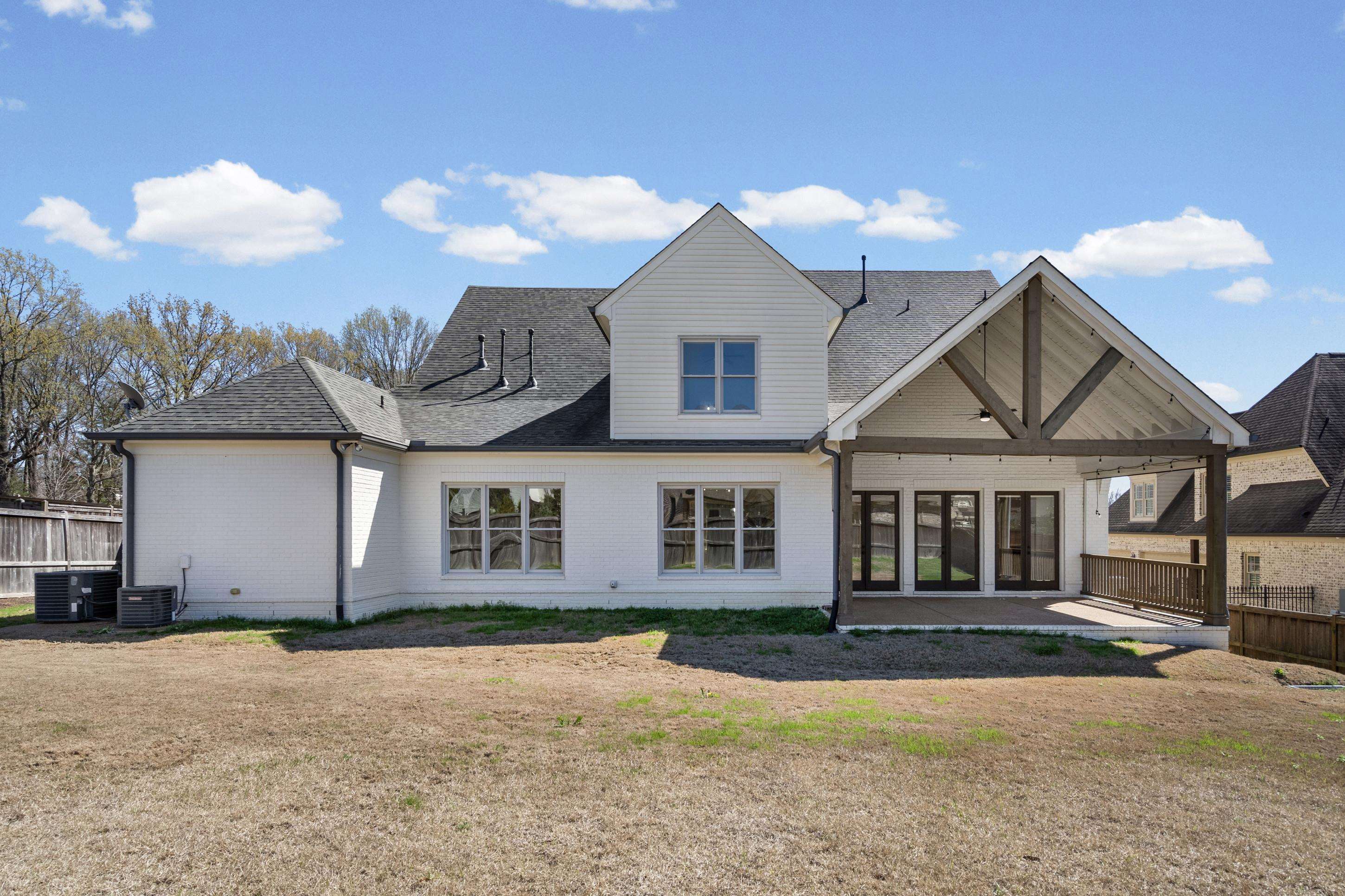 12608 Bravo Road Collierville, TN 38017 - Photo 26 of 40 a front view of a house with a yard and garage