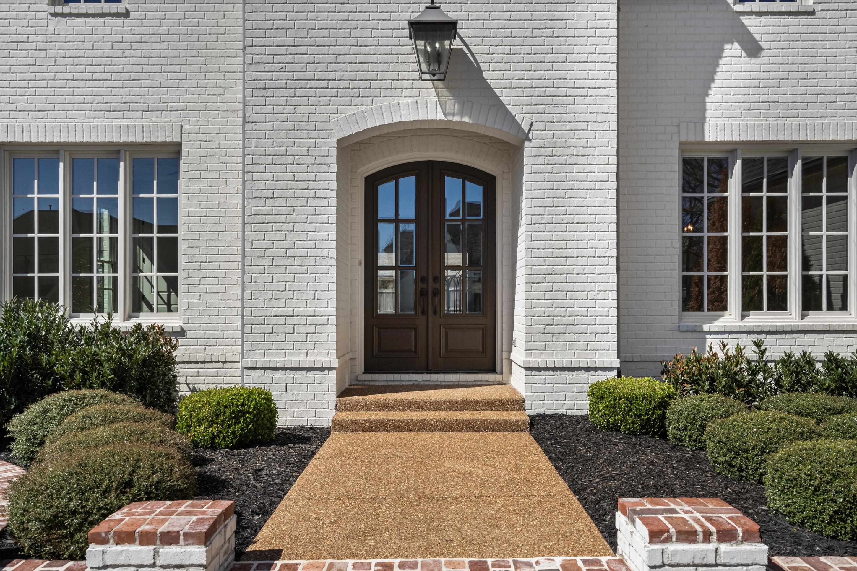 12608 Bravo Road Collierville, TN 38017 - Photo 27 of 40 a front view of a house with a garden