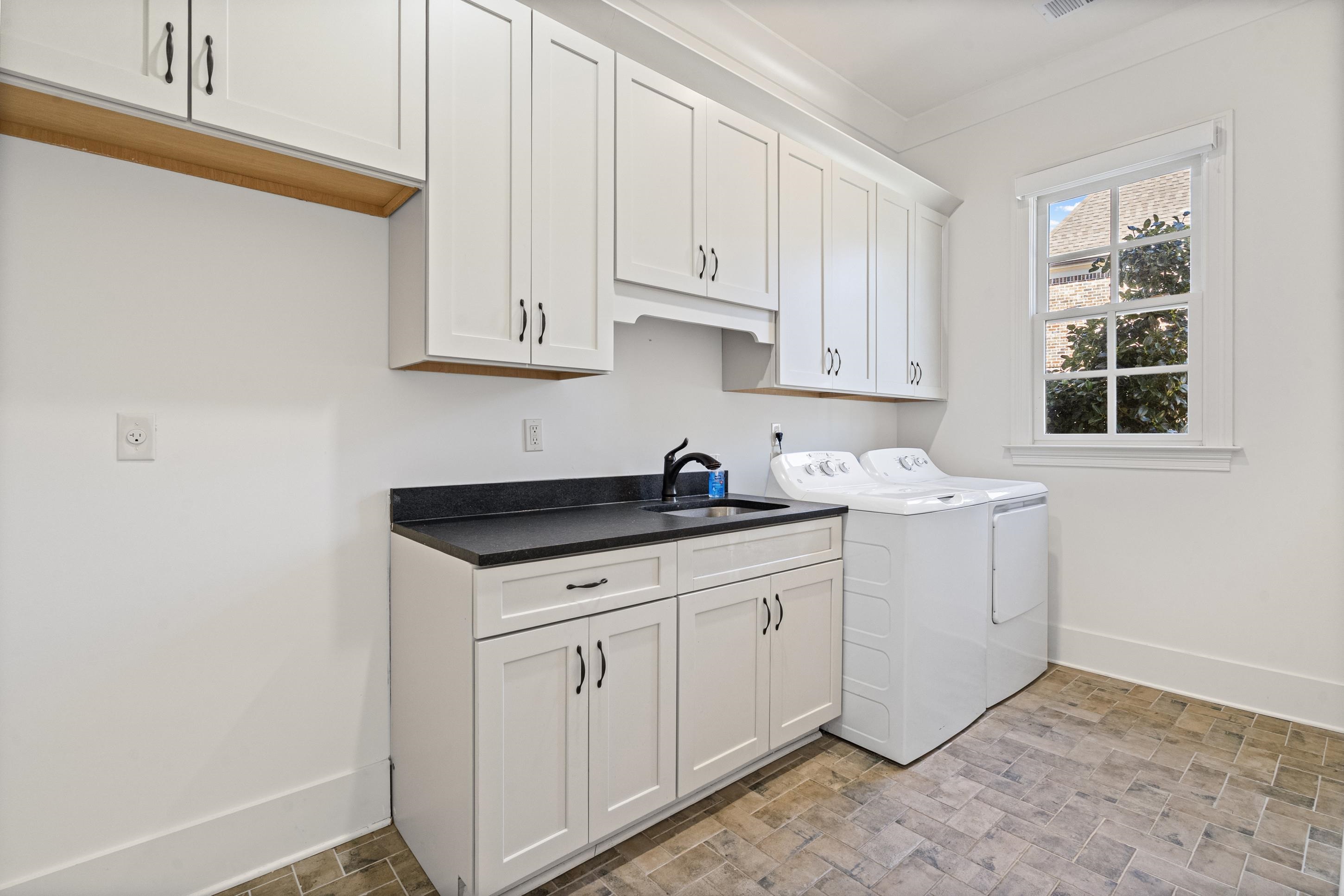 12608 Bravo Road Collierville, TN 38017 - Photo 7 of 40 a kitchen with granite countertop white cabinets and sink
