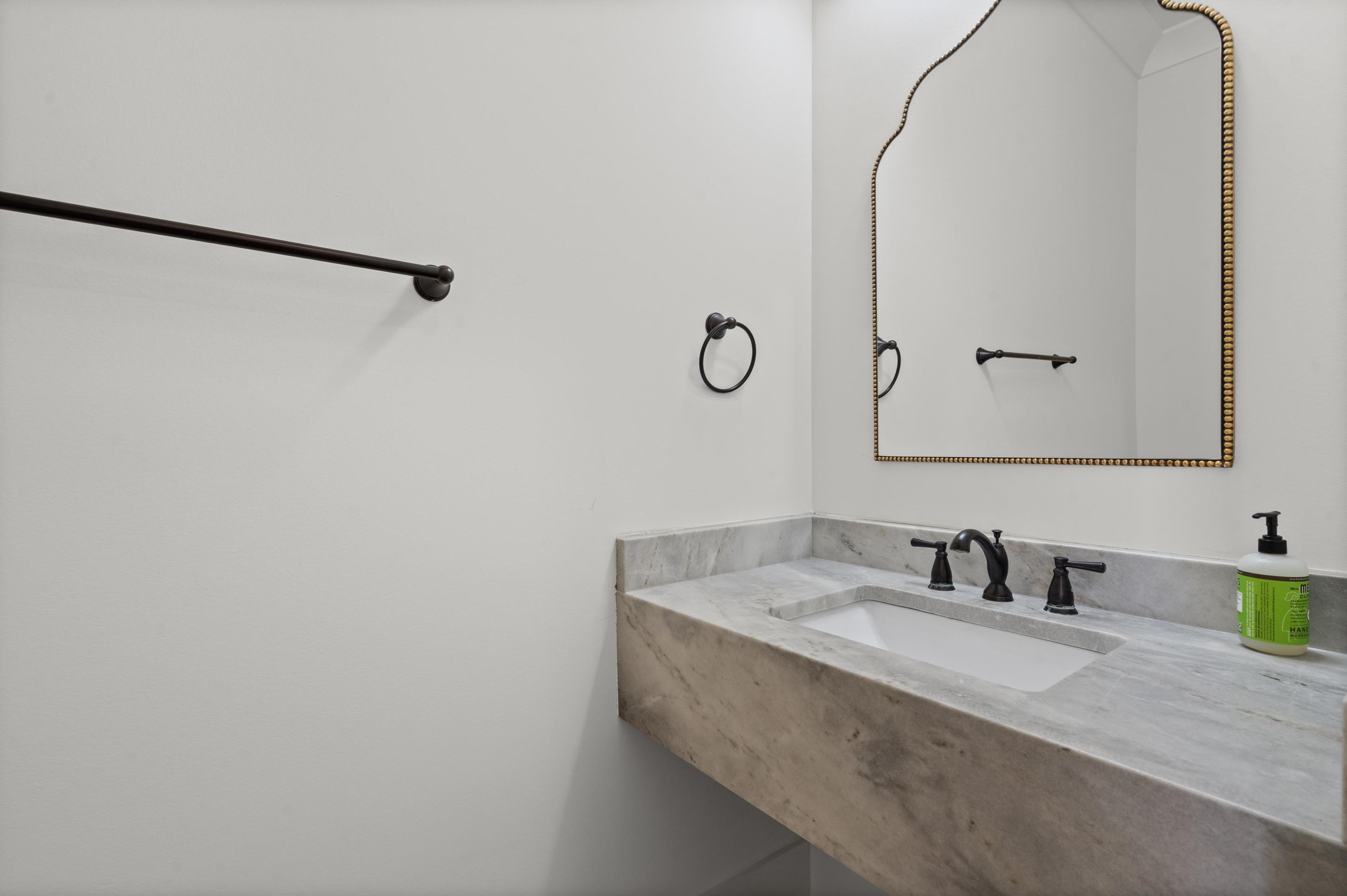 12608 Bravo Road Collierville, TN 38017 - Photo 8 of 40 a bathroom with a sink and a mirror