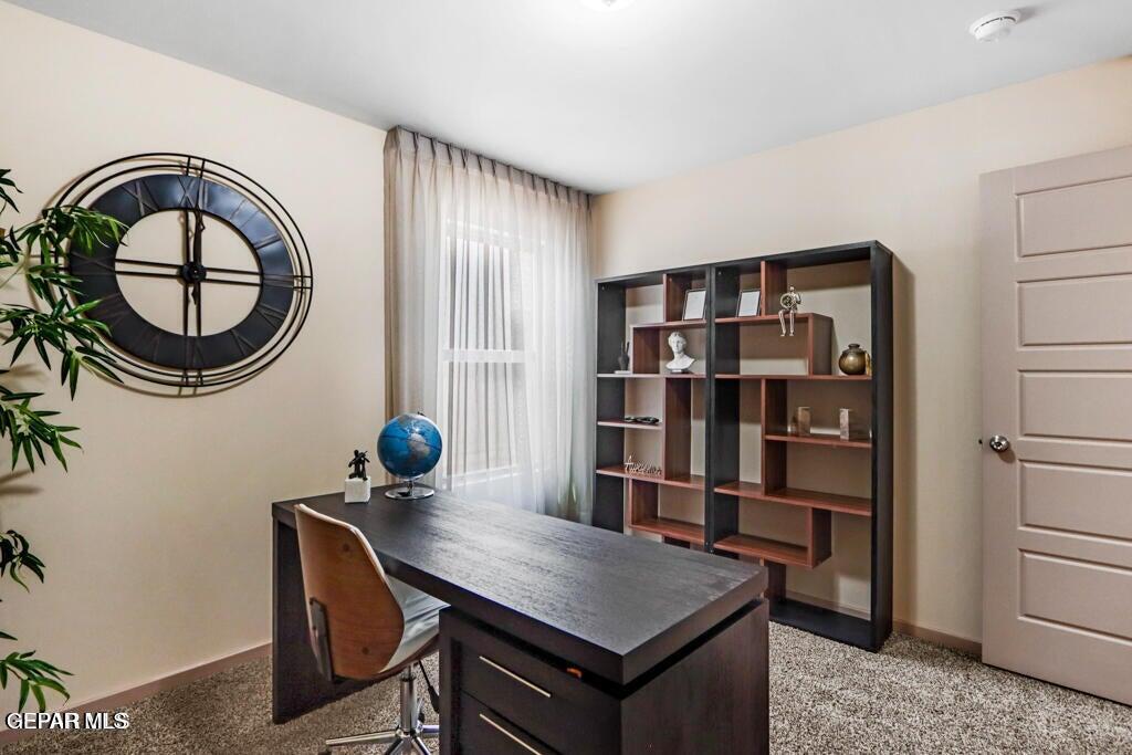 15040 Function Court El Paso, TX 79928 - Photo 7 of 10 a view of a workspace with furniture