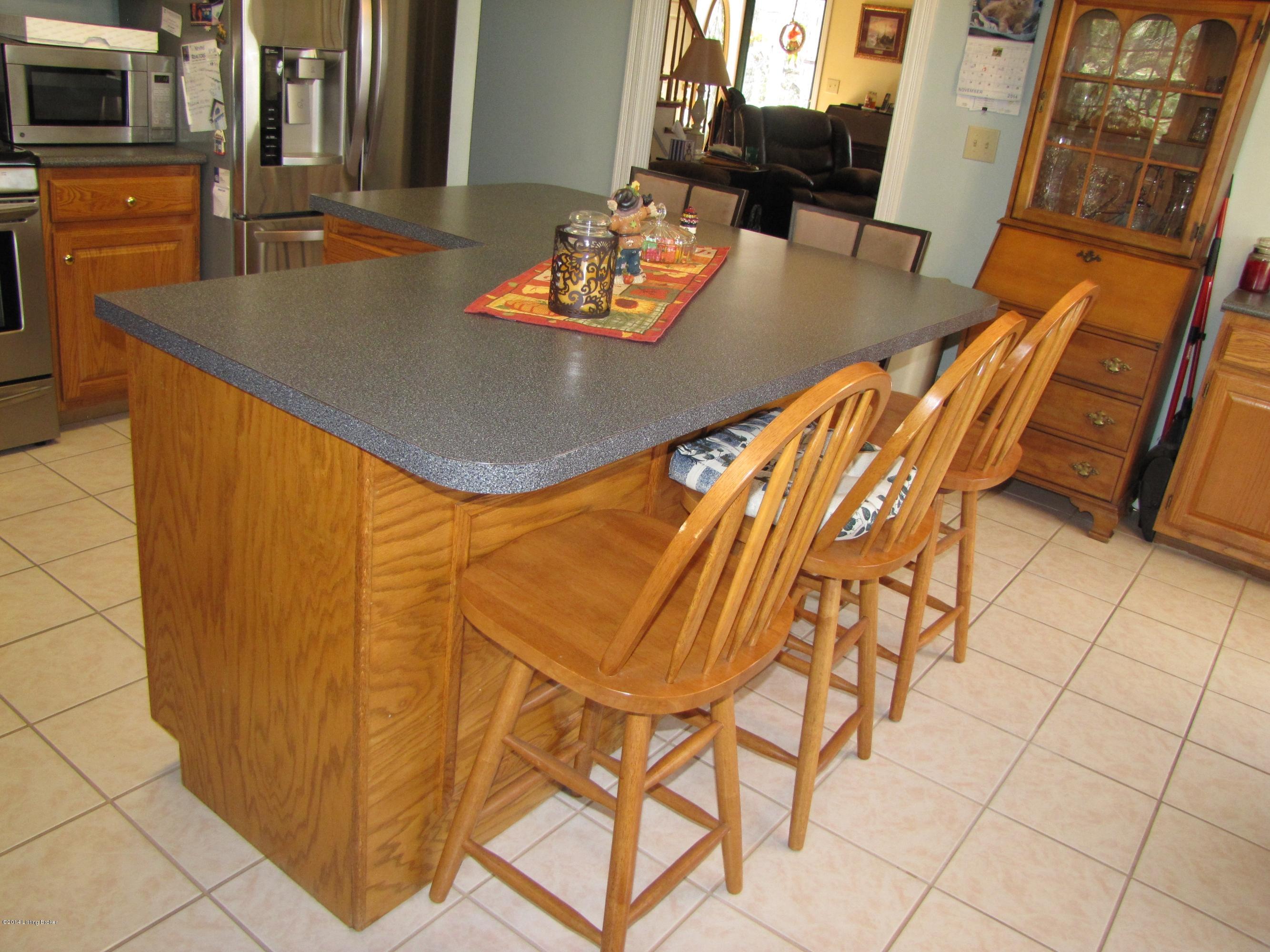 218 Fox Run Road Pendleton, KY 40055 - Photo 13 of 54 The huge L-shaped island allows comfortable seating for 5-6, additional under-cabinet storage, and plenty of counter space for prep work, entertaining, and dining!