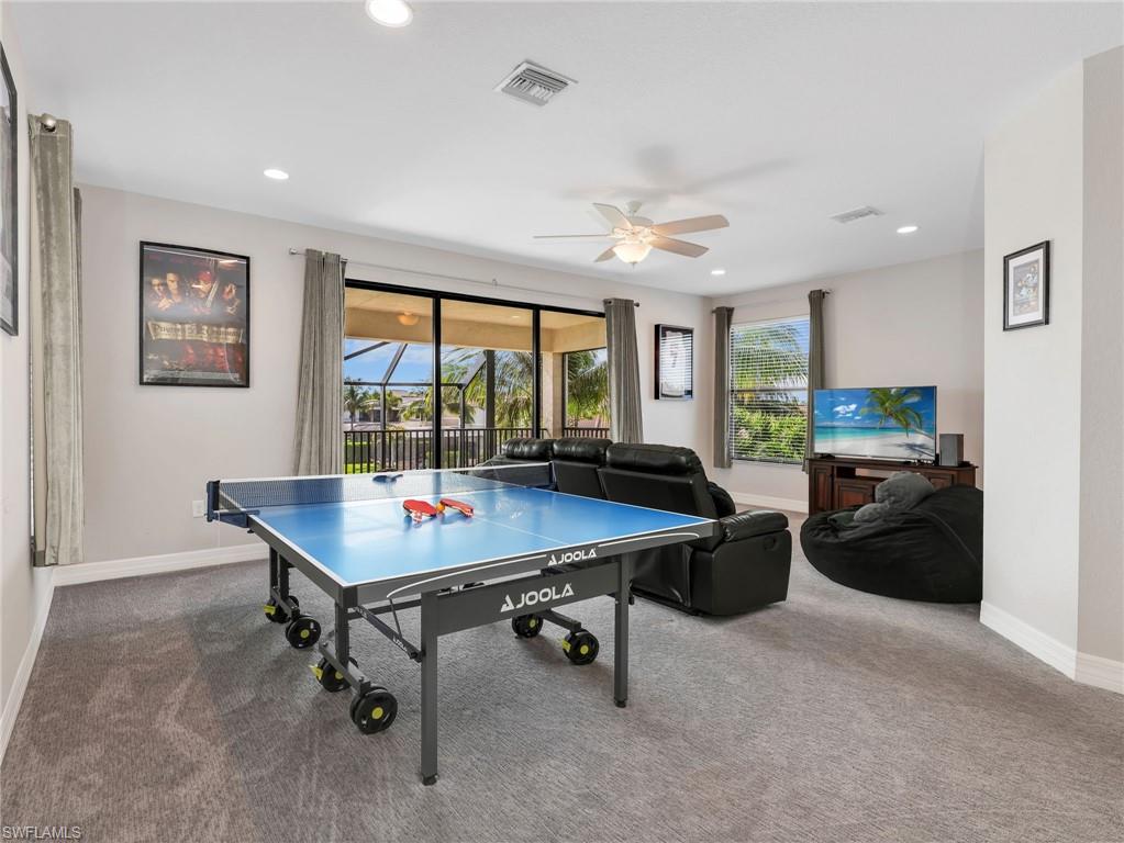 2756 Crystal Way Naples, FL 34119 - Photo 31 of 50 a room with furniture and a large window