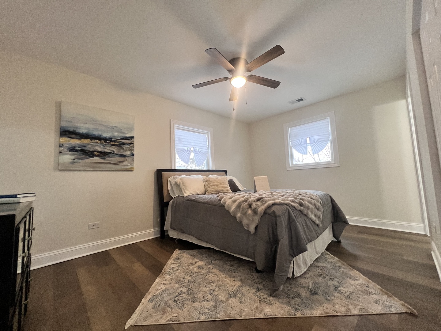 16607 Winchester Avenue Markham, IL 60428 - Photo 21 of 32 a bed sitting in a spacious bedroom next to a window