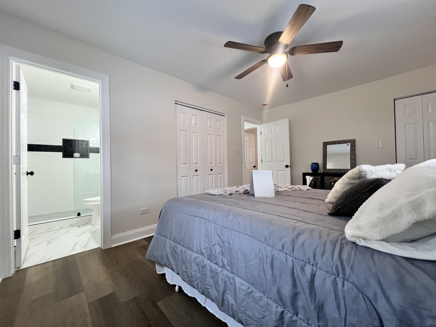 16607 Winchester Avenue Markham, IL 60428 - Photo 23 of 32 a bedroom with a bed and a glass door shower