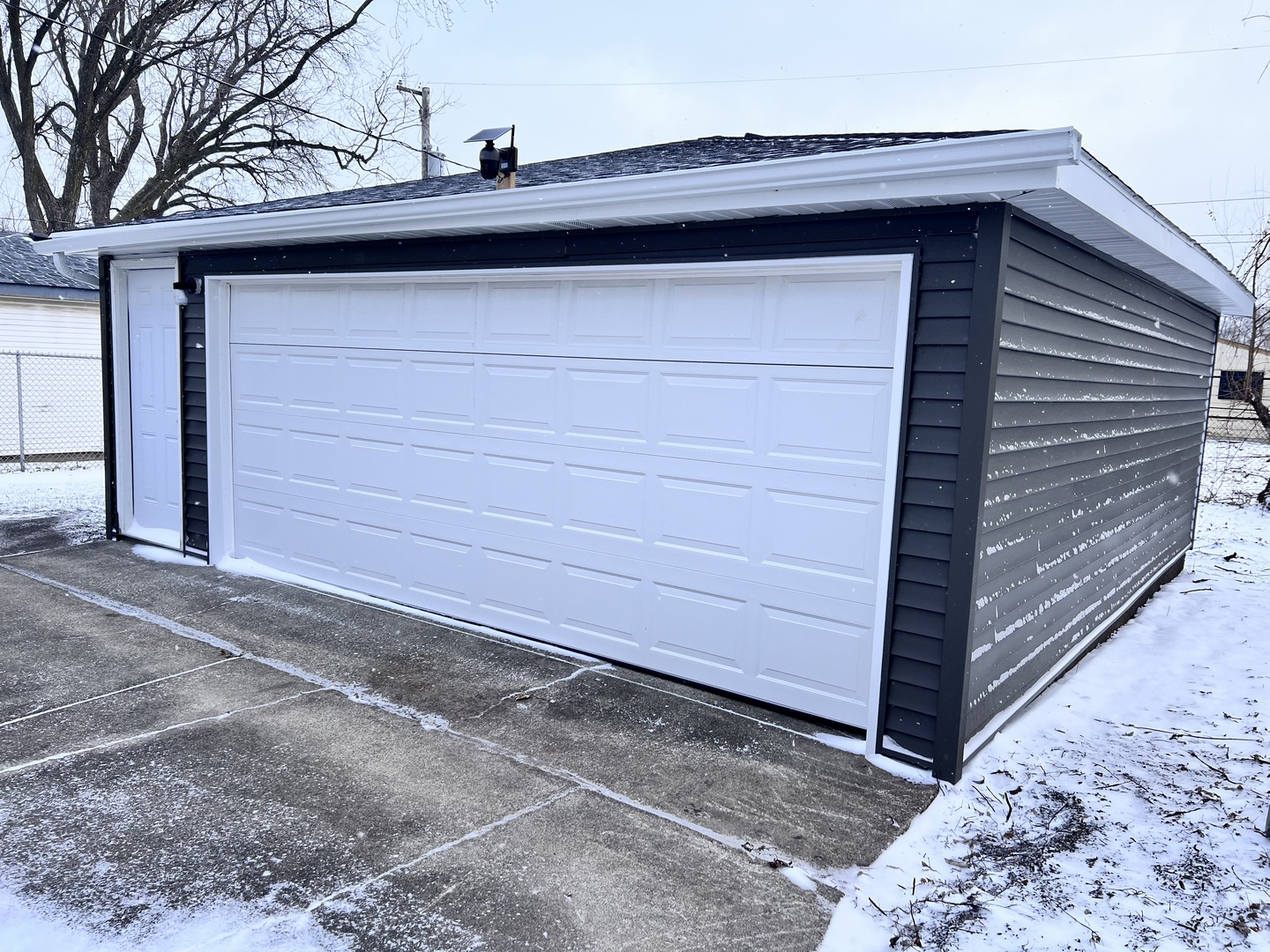 16607 Winchester Avenue Markham, IL 60428 - Photo 30 of 32 a side view of a house with a wooden fence
