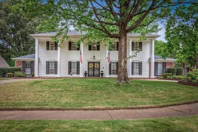 front view of a house with a yard