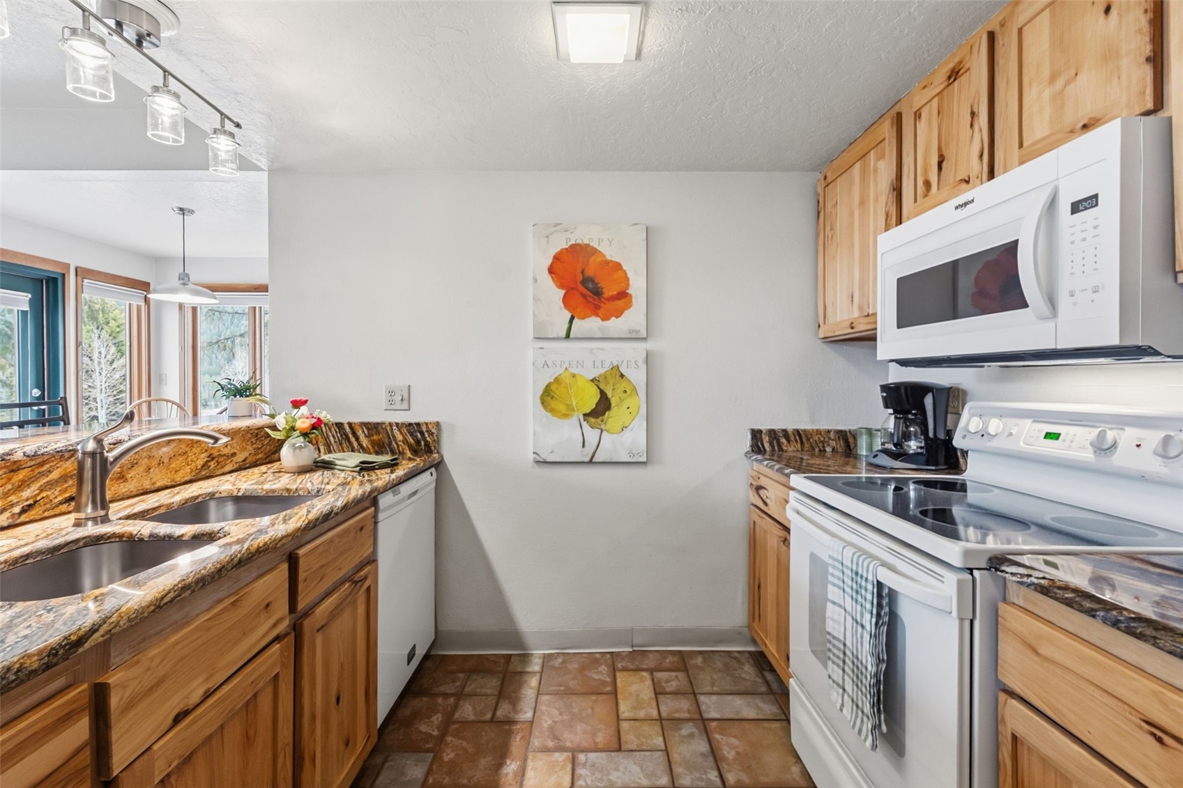 30 Tennis Club Road, Unit 1608 Keystone, CO 80435 - Photo 9 of 29 a kitchen with a sink stove and cabinets