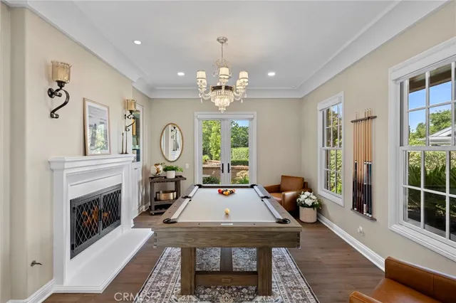 a living room with furniture large window and a fireplace