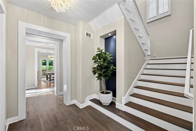 a living room with furniture fireplace and a large window