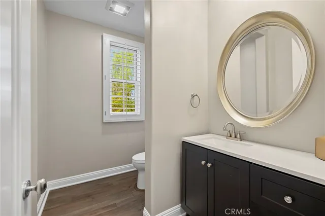 a kitchen with a table chairs stove and cabinets