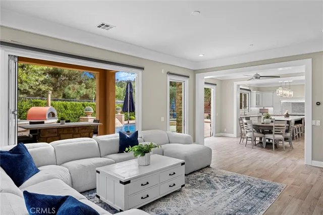 a kitchen with a stove and a chandelier
