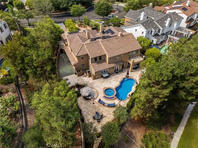 an aerial view of a house with a swimming pool