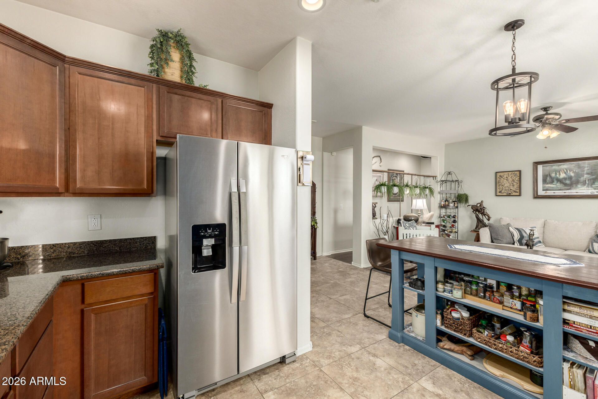 1849 South Balboa Drive Gilbert, AZ 85295 - Photo 11 of 35 a kitchen with stainless steel appliances granite countertop a refrigerator and a stove top oven
