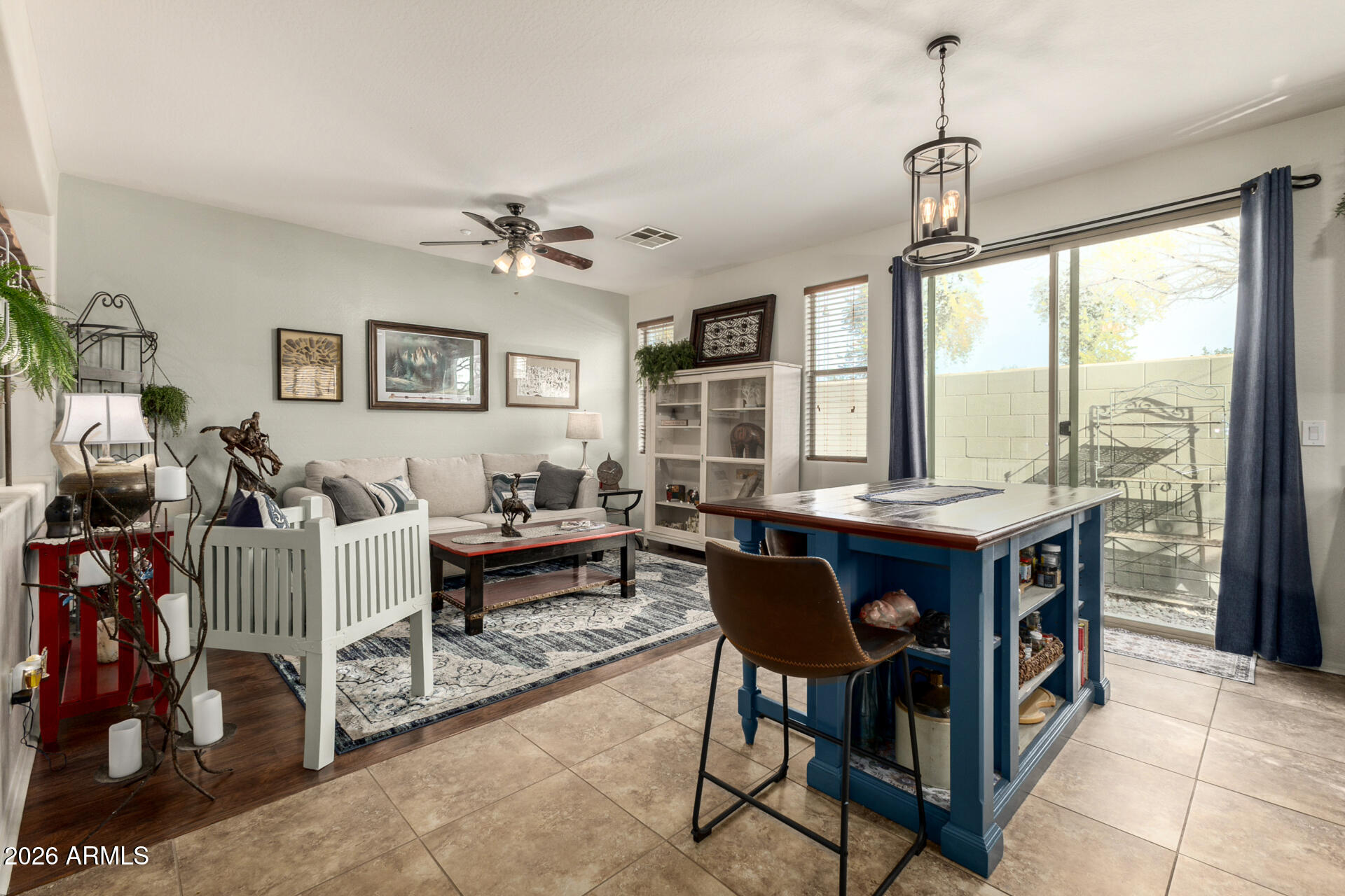 1849 South Balboa Drive Gilbert, AZ 85295 - Photo 18 of 35 a living room with furniture a large window and a chandelier