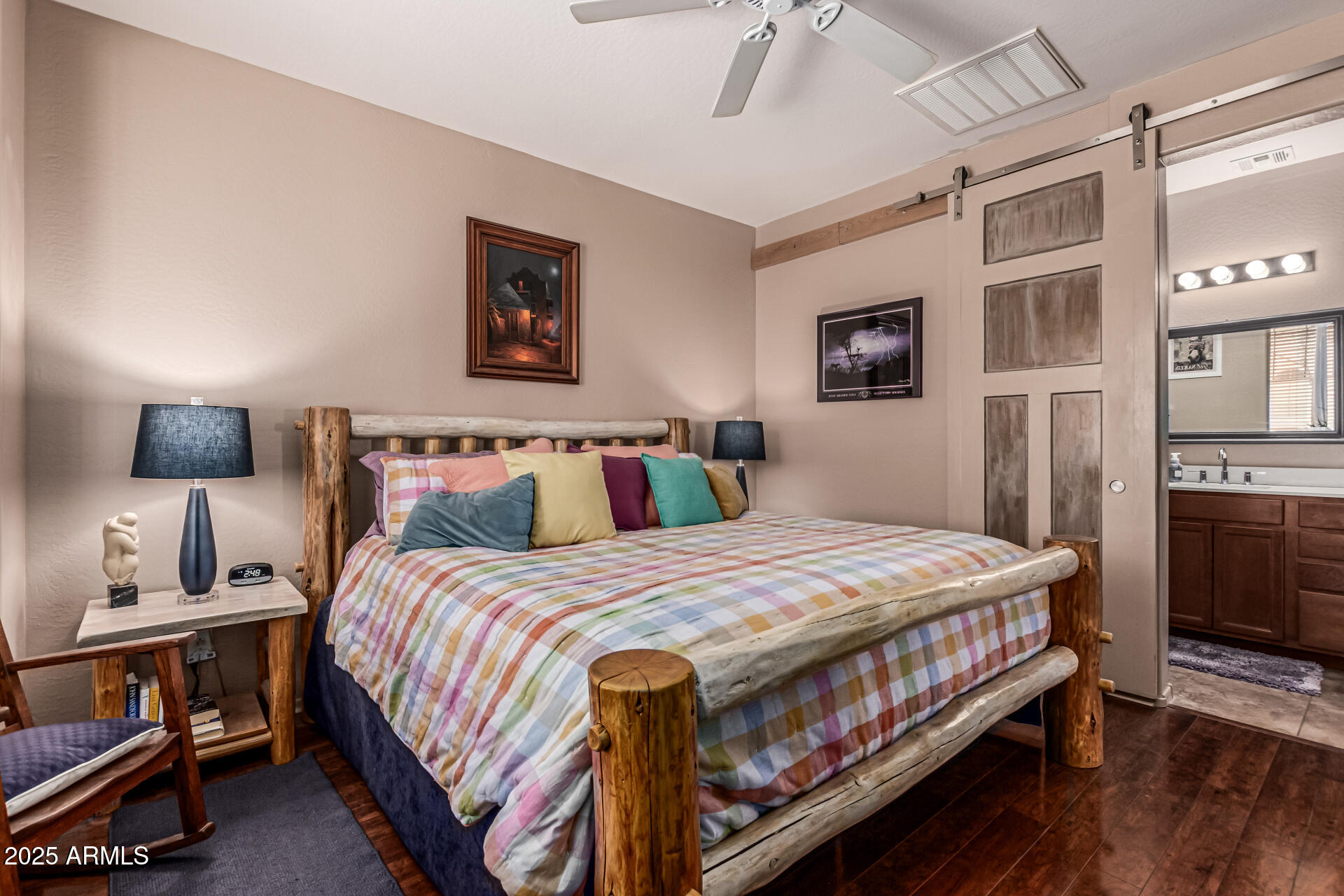 1849 South Balboa Drive Gilbert, AZ 85295 - Photo 22 of 35 a bedroom with a bed a couch and a chandelier