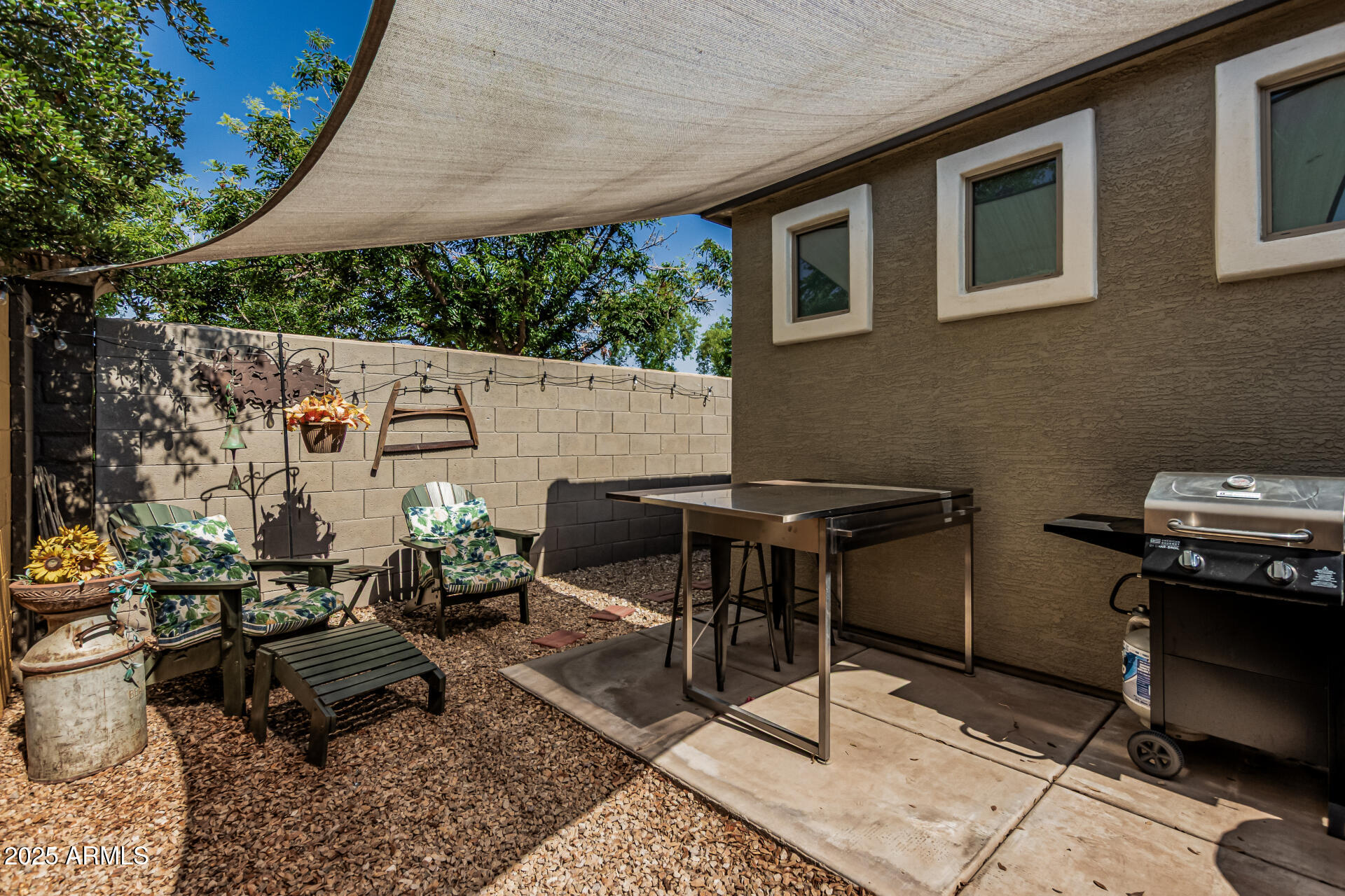 1849 South Balboa Drive Gilbert, AZ 85295 - Photo 31 of 35 a backyard of a house with outdoor seating