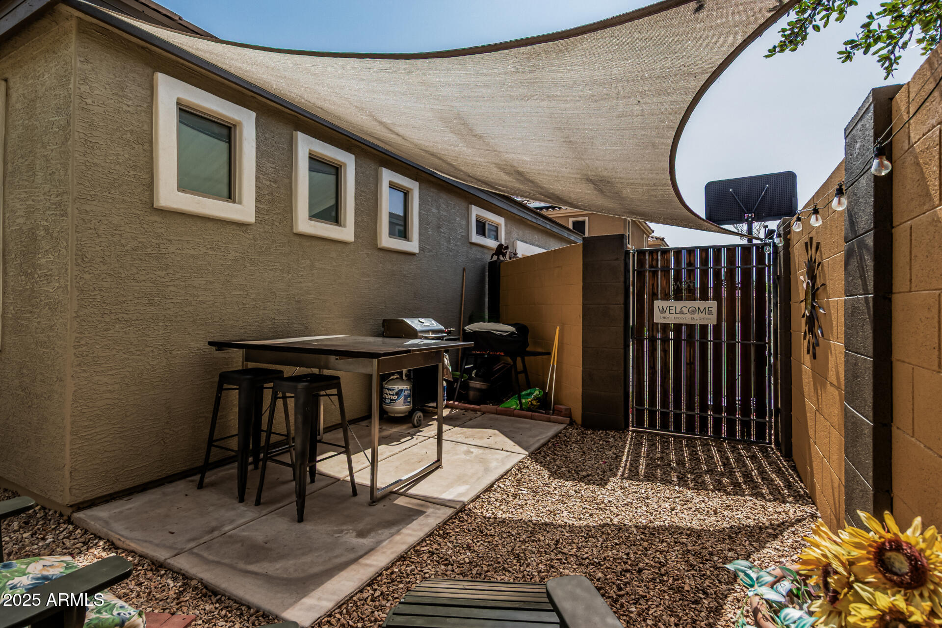 1849 South Balboa Drive Gilbert, AZ 85295 - Photo 32 of 35 a backyard of a house with table and chairs