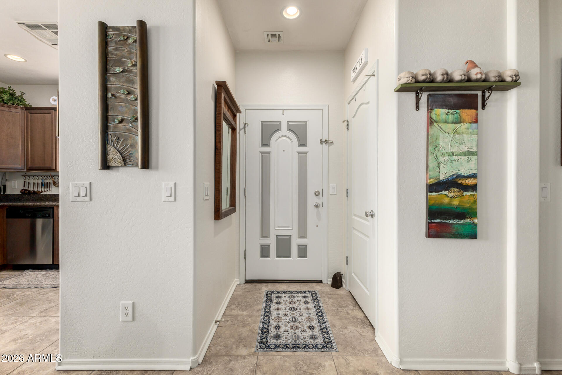 1849 South Balboa Drive Gilbert, AZ 85295 - Photo 4 of 35 a view of hallway with wooden floor and staircase