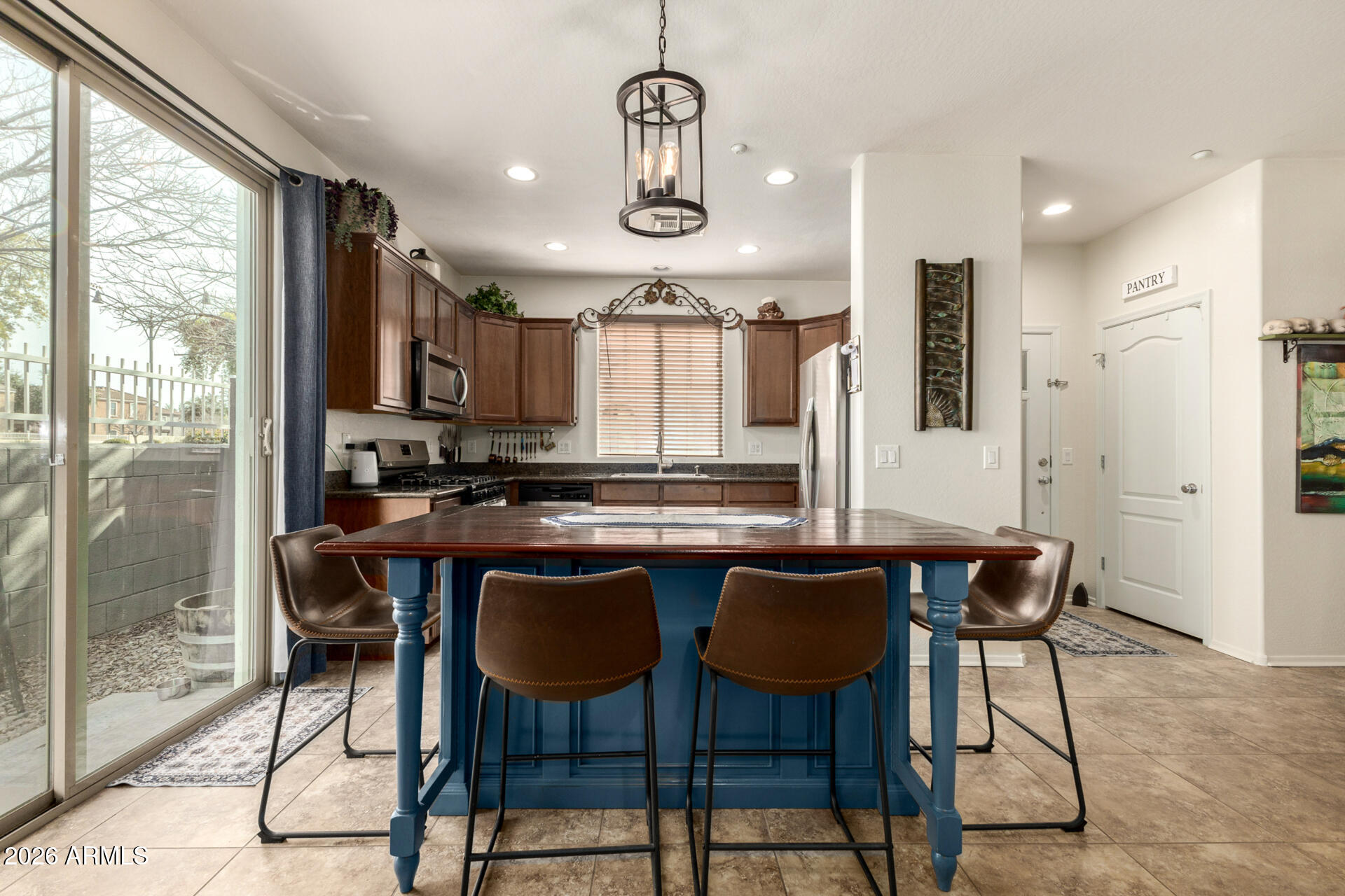 1849 South Balboa Drive Gilbert, AZ 85295 - Photo 5 of 35 a view of a dining room with furniture window and wooden floor