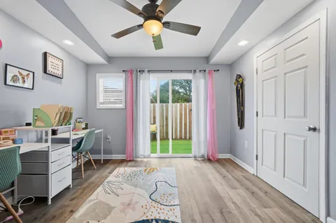 a view of a livingroom with furniture window and wooden floor