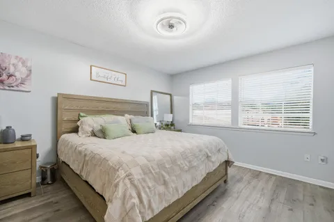 a bedroom with bed and window