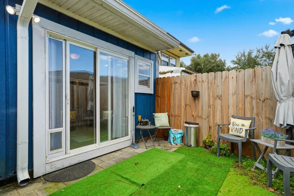 a view of a backyard with a patio