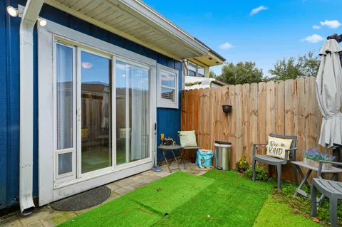 a view of a backyard with a patio