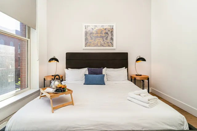 a living room with a large window and a table