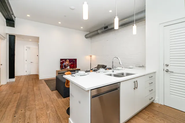 a kitchen with a sink and cabinets