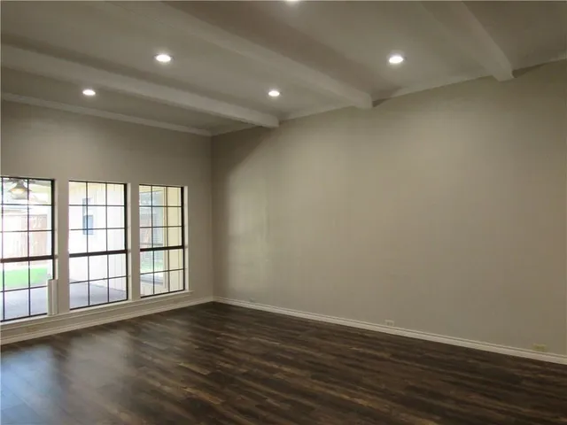 a bathroom with a granite countertop shower and a sink