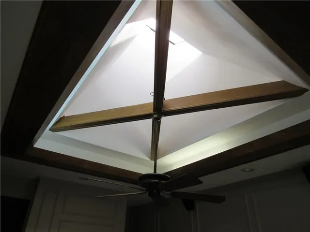 a bathroom with a granite countertop toilet and a sink
