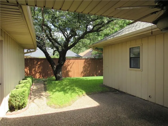 a backyard of a house with lots of green space