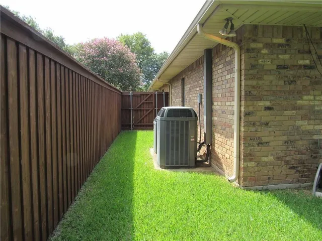 a view of a house with a yard and garage