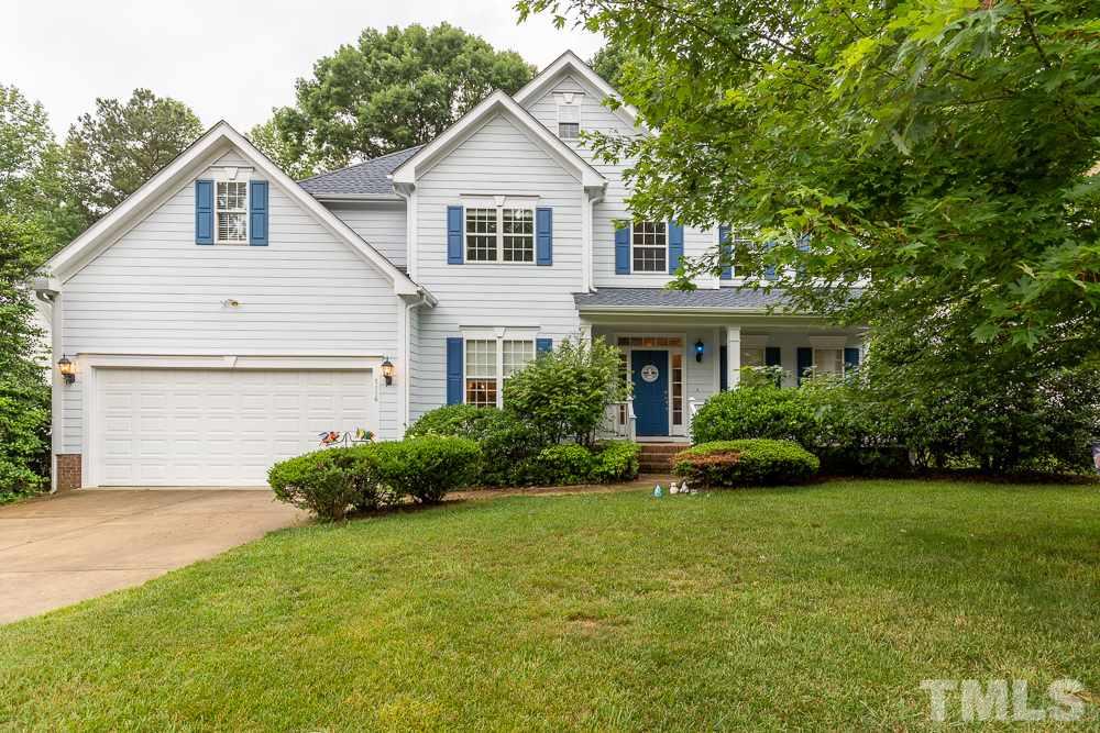 5116 Bartons Enclave Lane Raleigh, NC 27613 - Photo 1 of 30 a front view of a house with a yard and garage