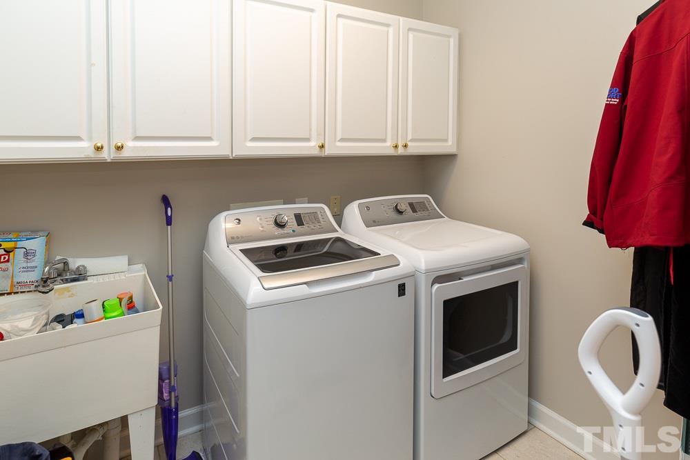 5116 Bartons Enclave Lane Raleigh, NC 27613 - Photo 13 of 30 a utility room with dryer and washer
