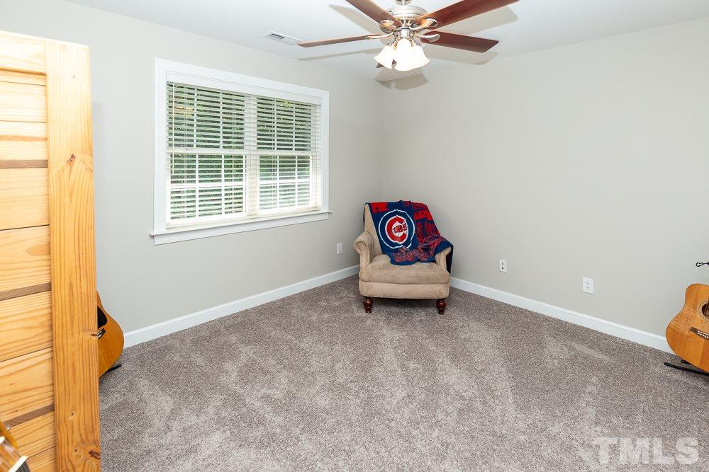 5116 Bartons Enclave Lane Raleigh, NC 27613 - Photo 20 of 30 a view of a livingroom with wooden floor and a window