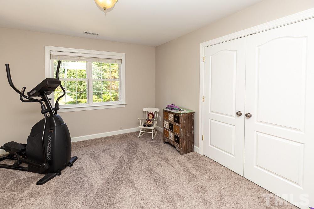 5116 Bartons Enclave Lane Raleigh, NC 27613 - Photo 23 of 30 a view of a room with gym equipment