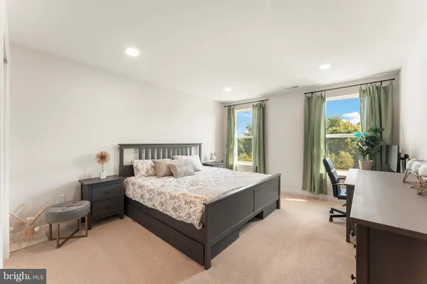 a bedroom with a workspace