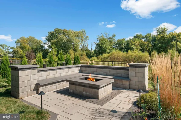 a view of a roof deck with furniture