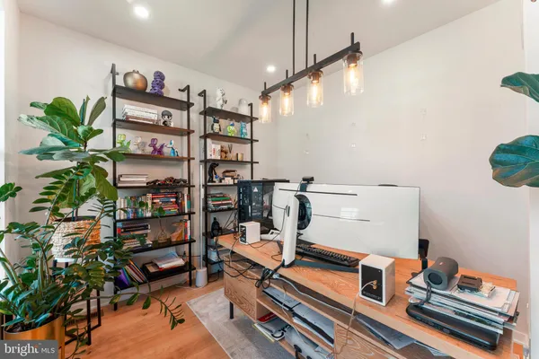 a reading room with furniture and wooden floor