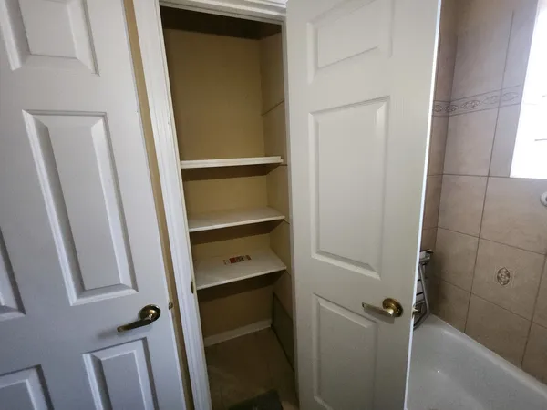 a bathroom with a shower and a sink