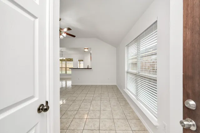 a view of a bathroom with a shower and a sink