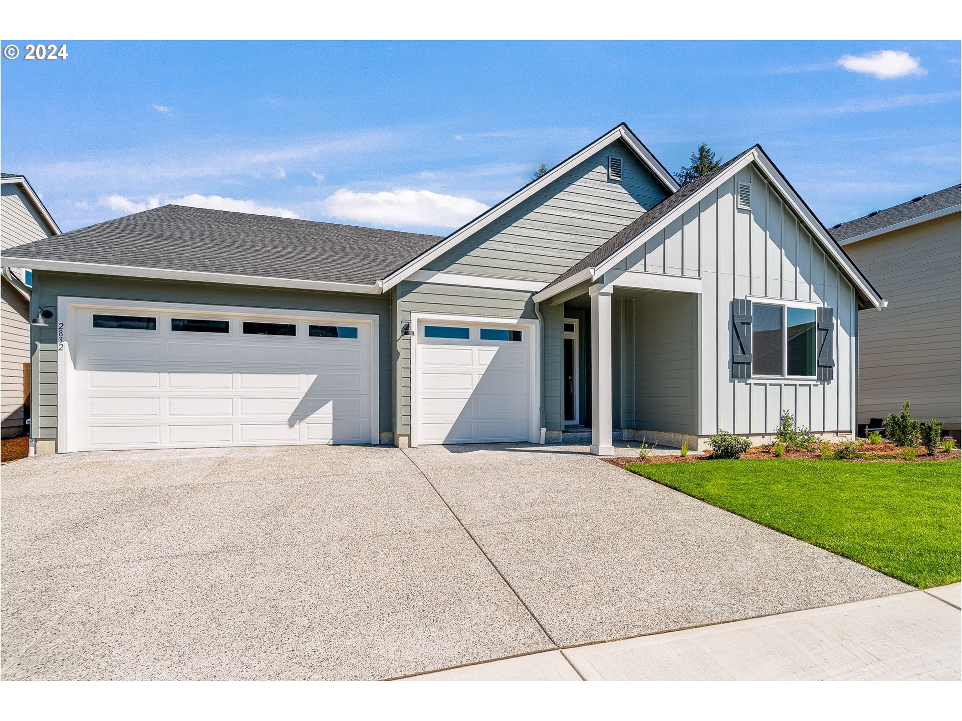 900 South 29th Court Ridgefield, WA 98642 - Photo 2 of 22 a front view of a house with a yard and garage