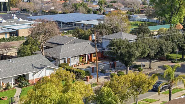 a view of multiple houses with yard