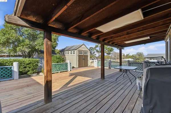 a view of a balcony with wooden floor