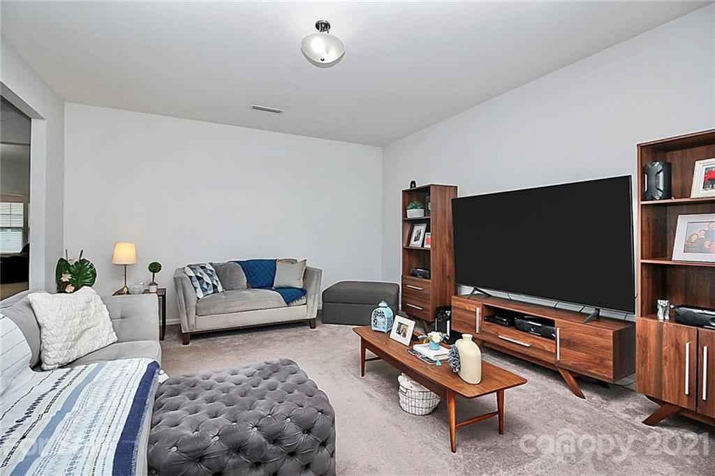 3034 Riker Street Clover, SC 29710 - Photo 19 of 42 a living room with furniture and a flat screen tv
