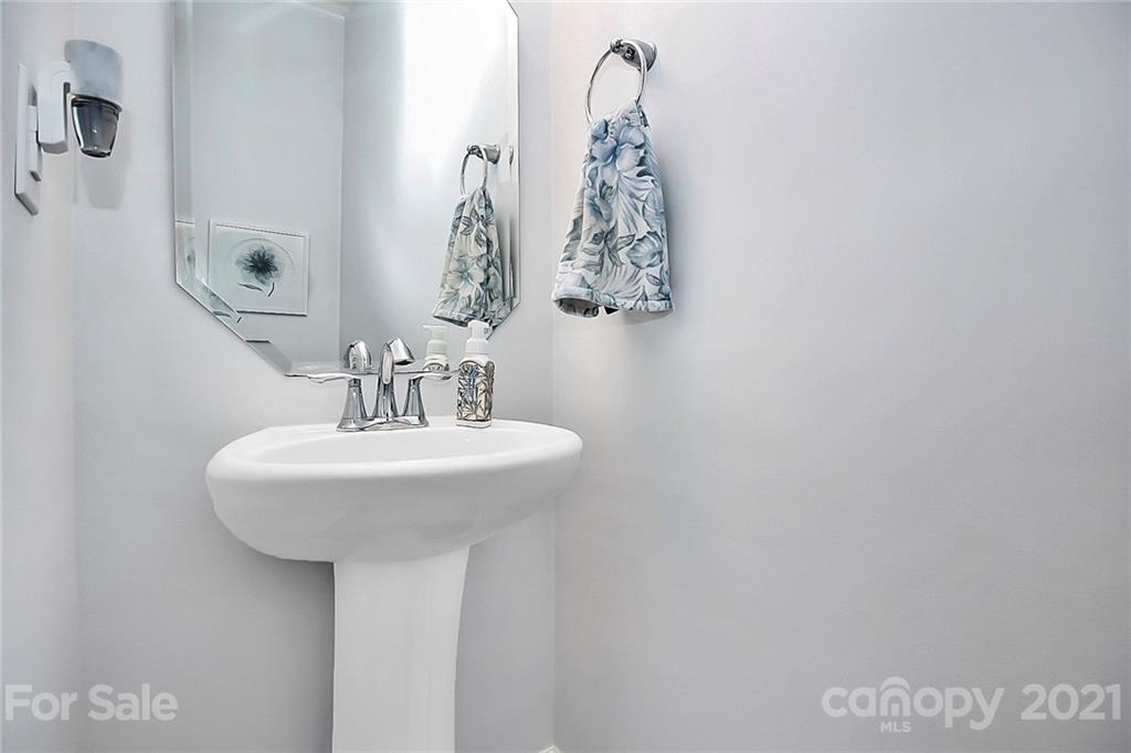 3034 Riker Street Clover, SC 29710 - Photo 21 of 42 a bathroom with a sink and a mirror