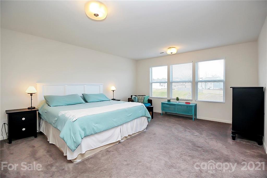 3034 Riker Street Clover, SC 29710 - Photo 23 of 42 a spacious bedroom with a bed and a window
