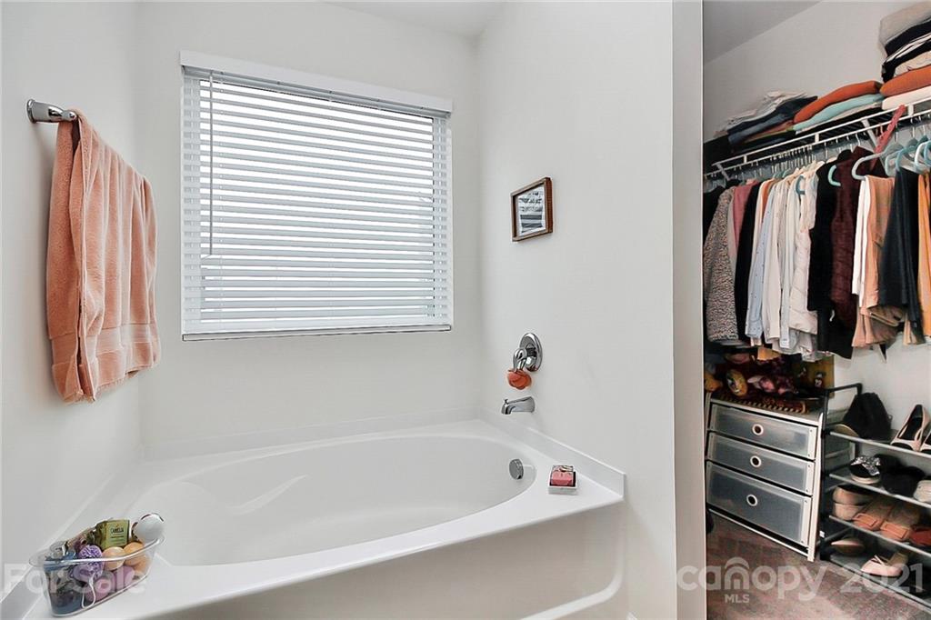 3034 Riker Street Clover, SC 29710 - Photo 29 of 42 a bathroom with a bathtub and a shower